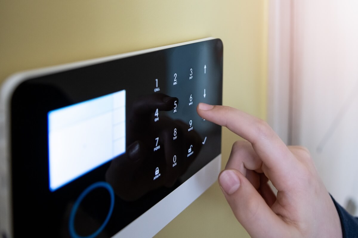 hand in front of backlit keypad